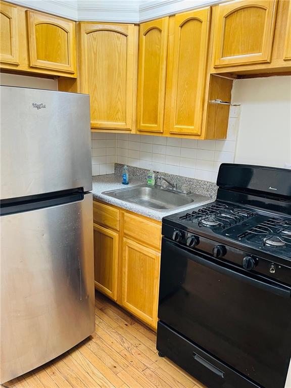 2330 Voorhies Avenue, Unit 1C Brooklyn, NY 11235 - Photo 8 of 10 a kitchen with stainless steel appliances granite countertop a stove and a microwave