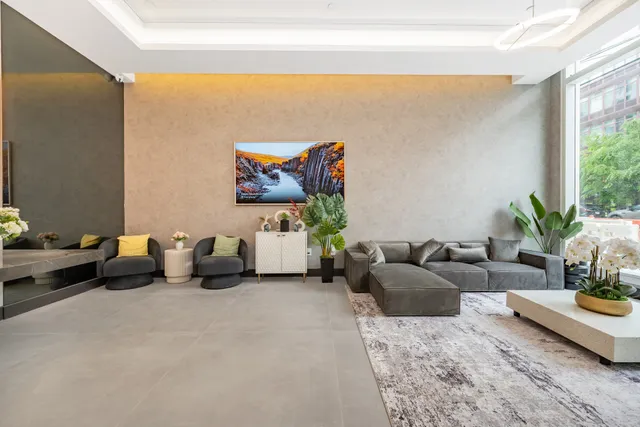 a living room with furniture and a large window