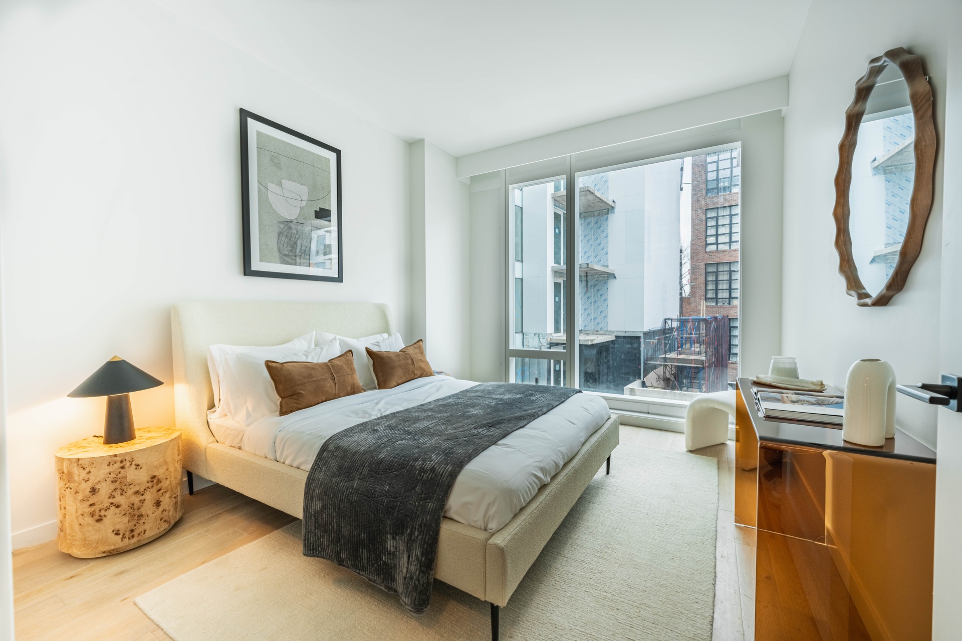 37-34 33rd Street, Unit 6B Queens, NY 11101 - Photo 4 of 11 a bedroom with a bed couch and a window