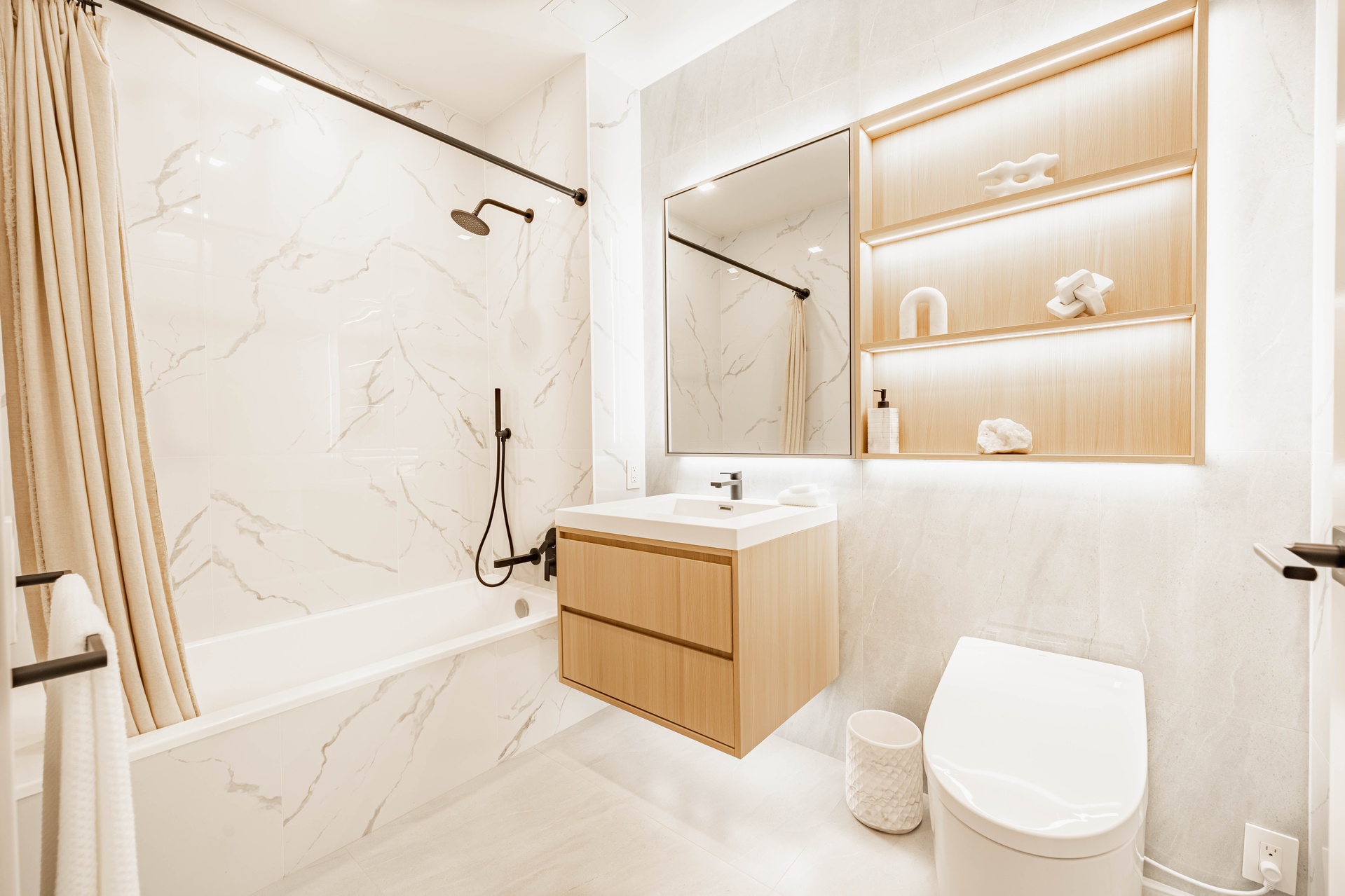 37-34 33rd Street, Unit 6B Queens, NY 11101 - Photo 5 of 11 a bathroom with a sink toilet and shower