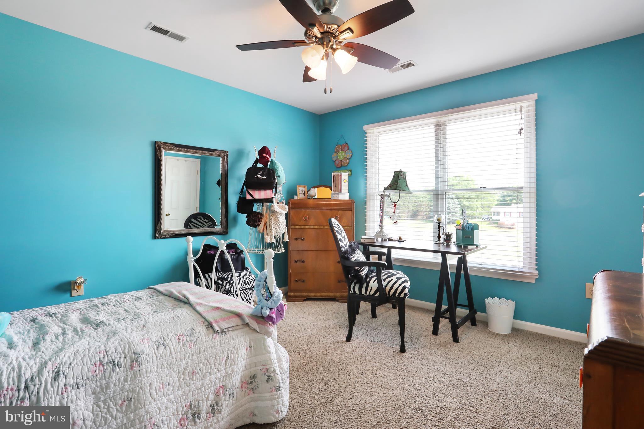 13816 Big Pool Road Clear Spring, MD 21722 - Photo 13 of 24 a bedroom with bed and a chair