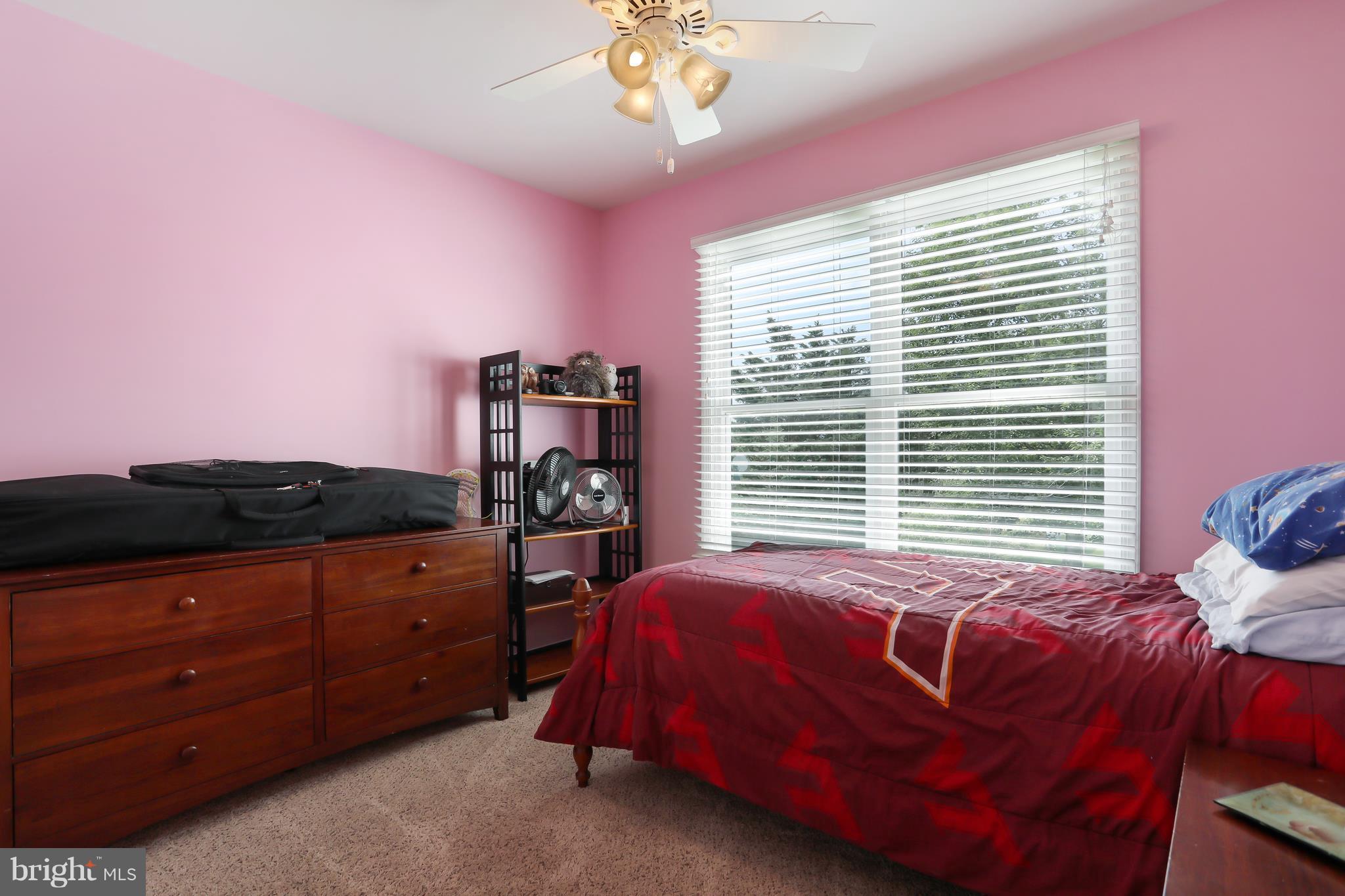 13816 Big Pool Road Clear Spring, MD 21722 - Photo 14 of 24 a bedroom with a bed and a chandelier