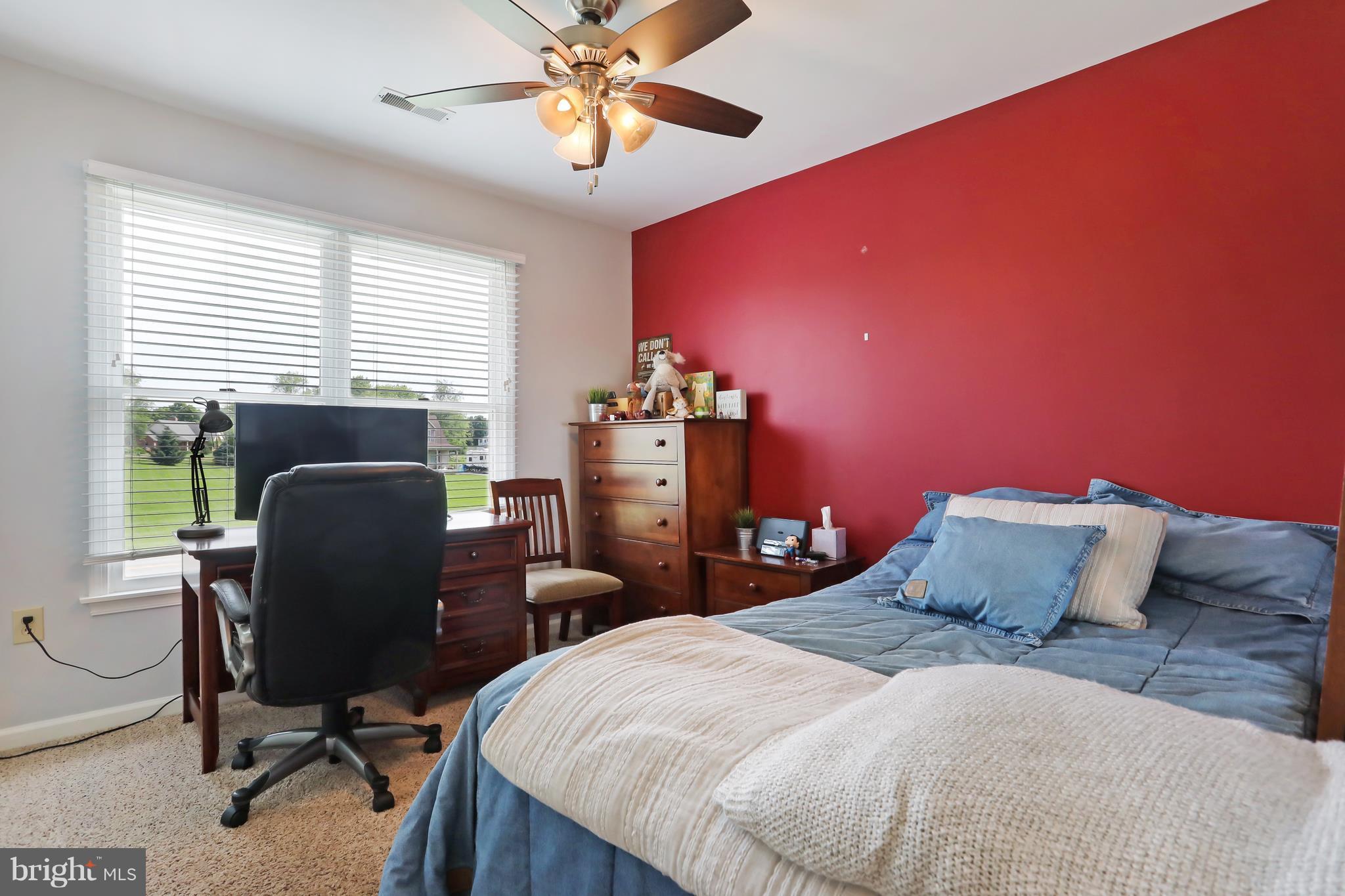 13816 Big Pool Road Clear Spring, MD 21722 - Photo 16 of 24 a bedroom with a bed and a chair