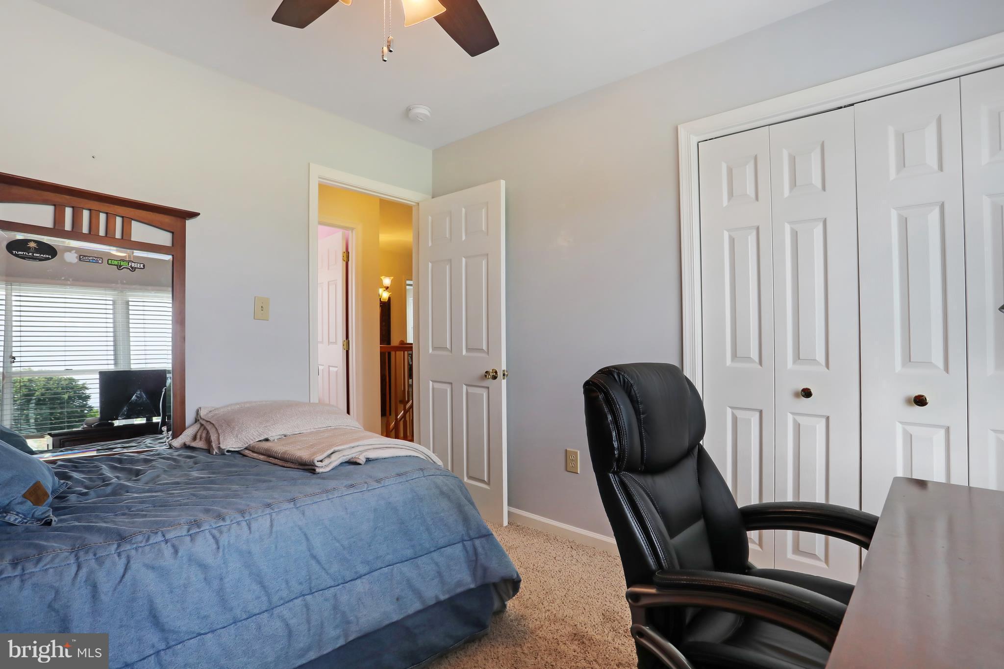 13816 Big Pool Road Clear Spring, MD 21722 - Photo 17 of 24 a bedroom with a chair and a large window
