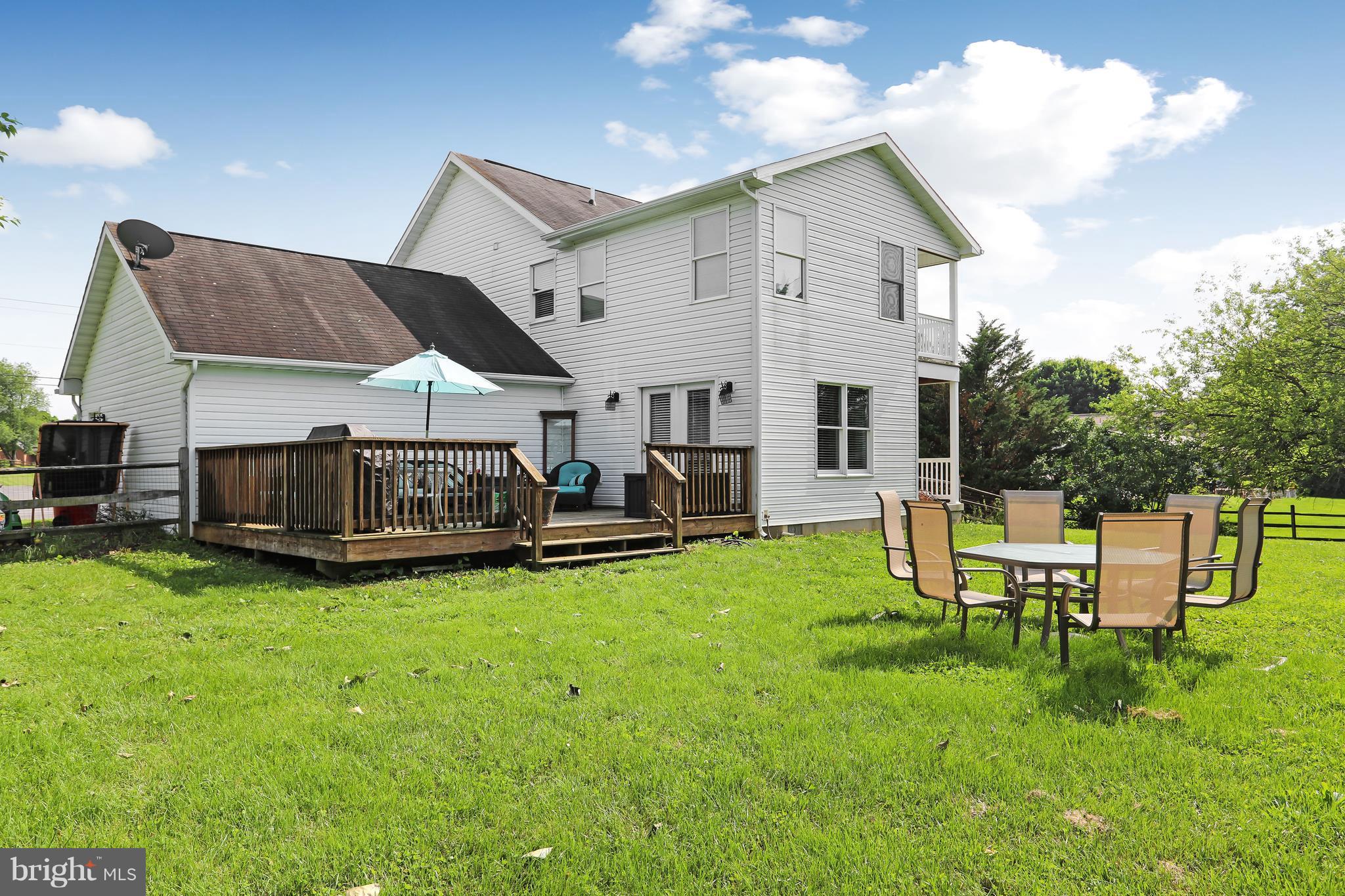 13816 Big Pool Road Clear Spring, MD 21722 - Photo 20 of 24 a view of a house with backyard porch and sitting area