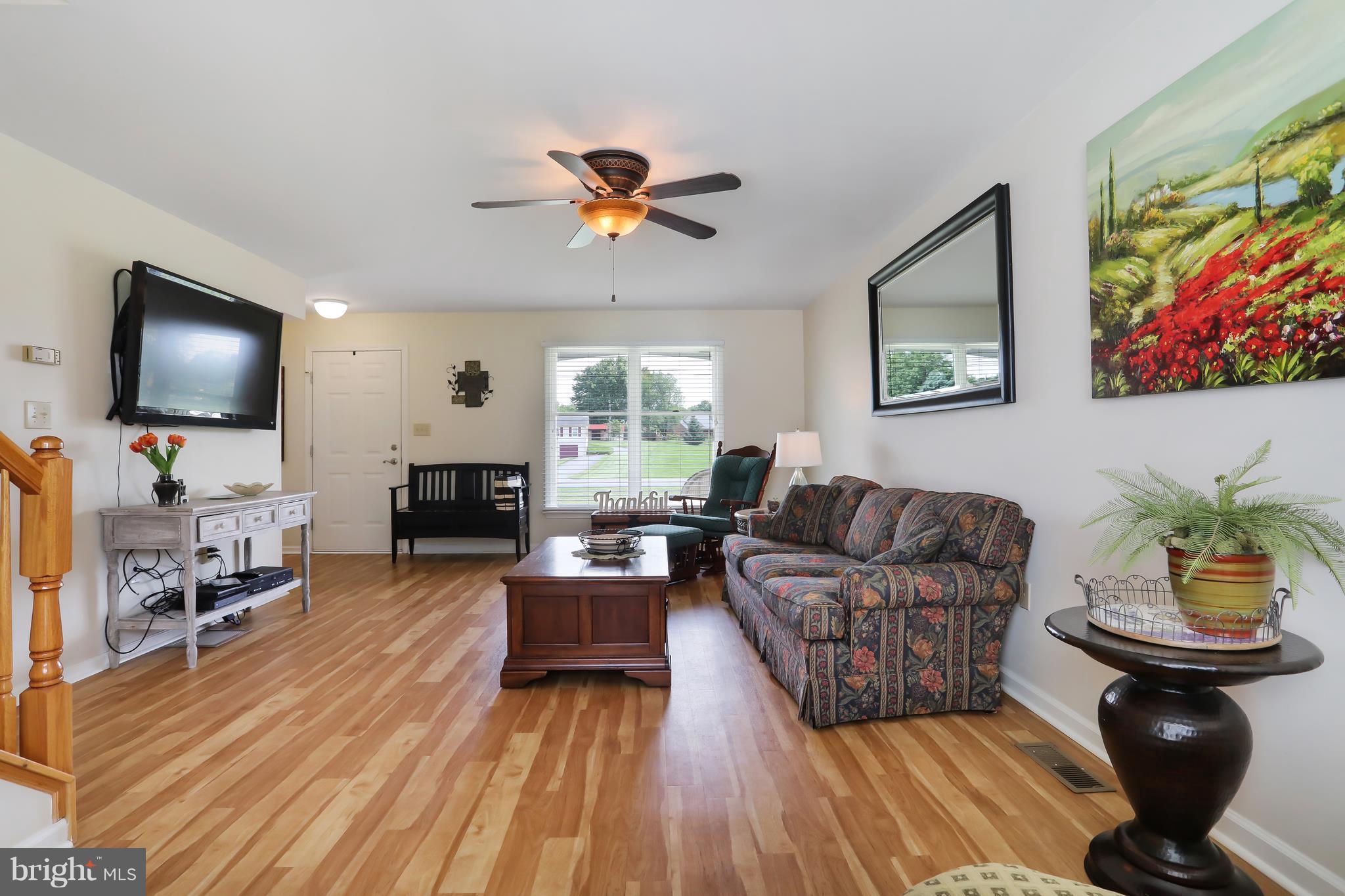 13816 Big Pool Road Clear Spring, MD 21722 - Photo 3 of 24 a living room with furniture and a flat screen tv