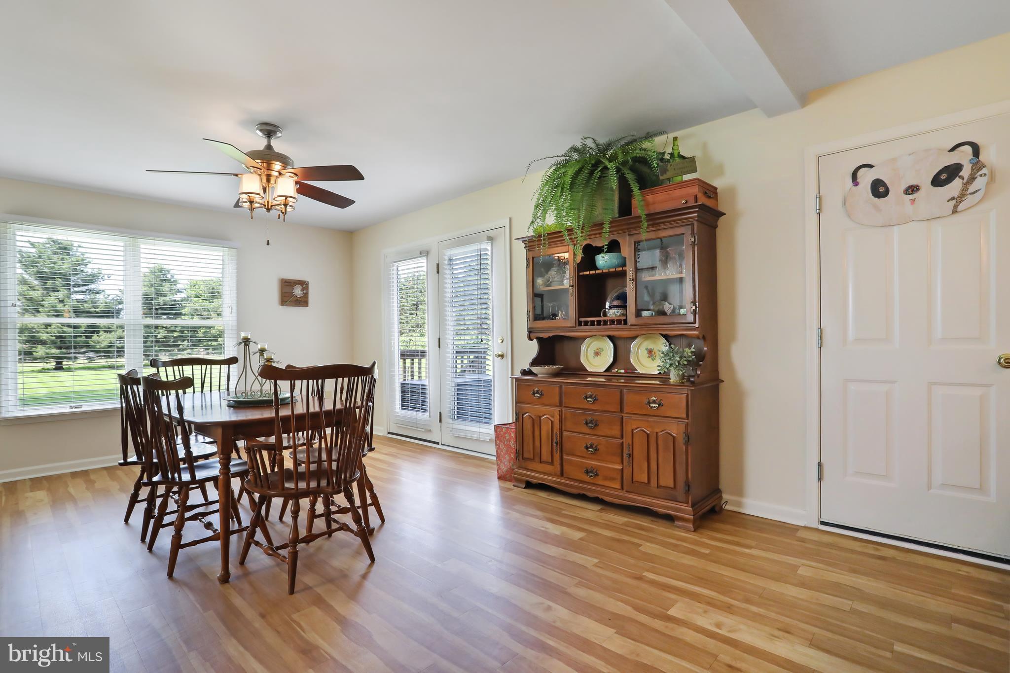 13816 Big Pool Road Clear Spring, MD 21722 - Photo 6 of 24 a view of a dining room with furniture window and wooden floor