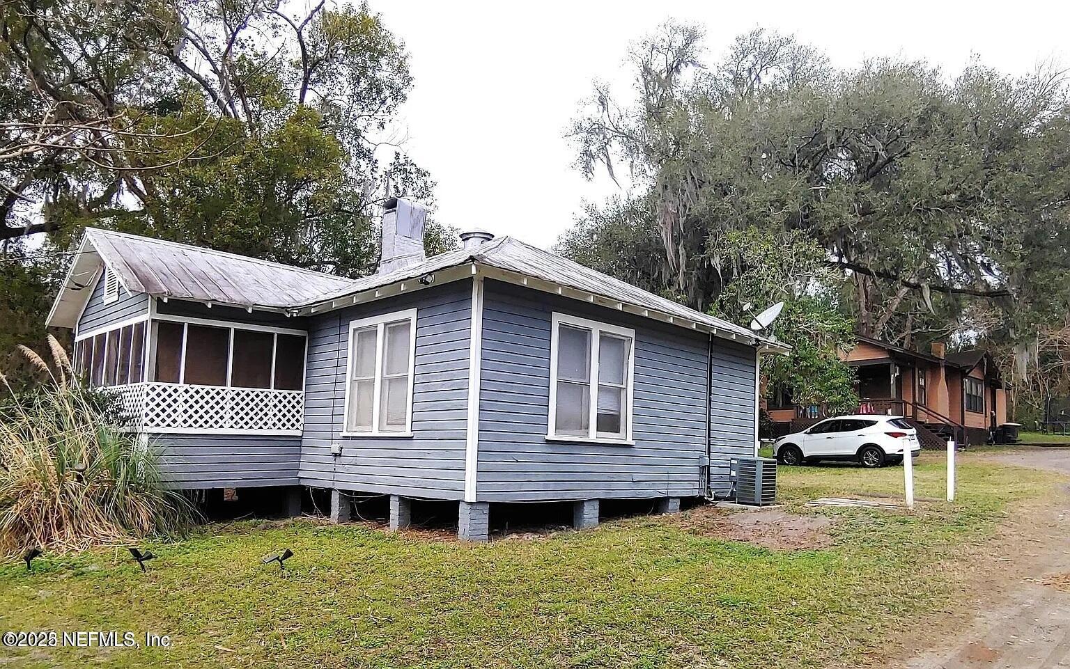 7781 Lenox Avenue Jacksonville, FL 32221 - Photo 12 of 15 a front view of a house with a yard
