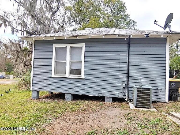 7781 Lenox Avenue Jacksonville, FL 32221 - Photo 13 of 15 a side view of a house with a yard