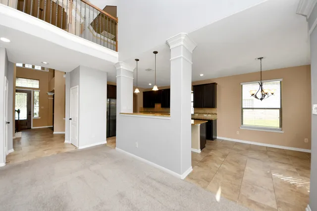a view of a kitchen with a sink and a window