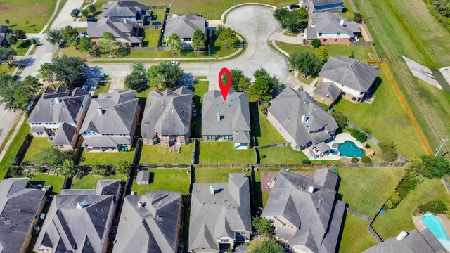 a view of a swimming pool with outdoor seating