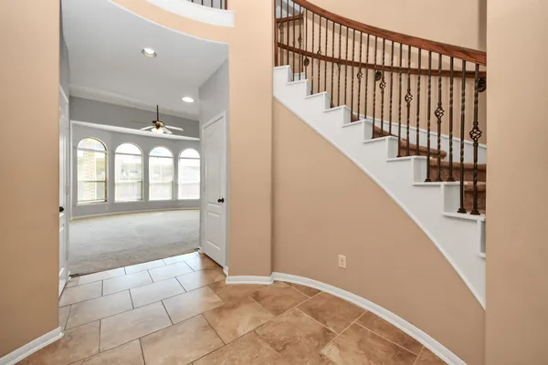 a view of an entryway with wooden floor