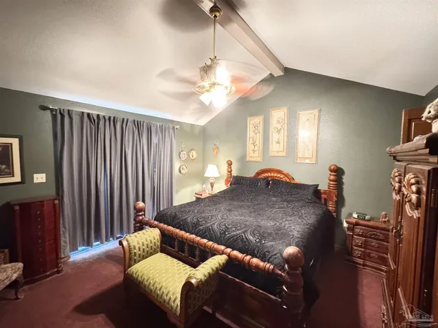 a living room with furniture fireplace and a chandelier