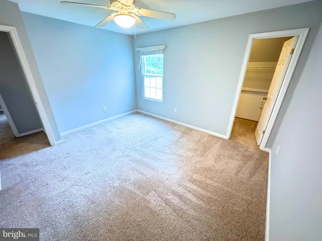 a bedroom with furniture and a fireplace
