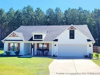 a aerial view of a house with swimming pool in front of it