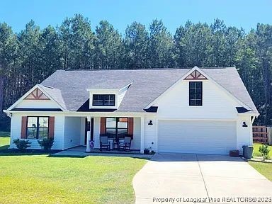 83 Kotata Avenue Bunnlevel, NC 28323 - Photo 1 of 17 a aerial view of a house with swimming pool in front of it