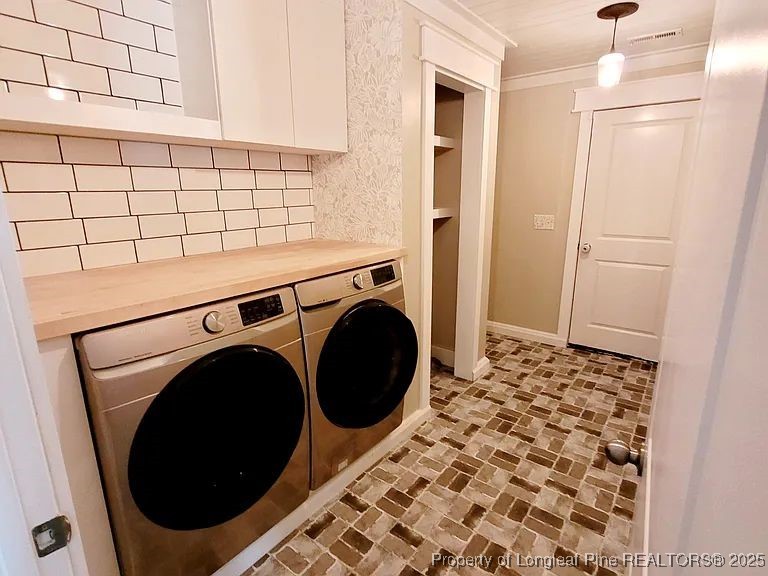 83 Kotata Avenue Bunnlevel, NC 28323 - Photo 11 of 17 a utility room with dryer and washer