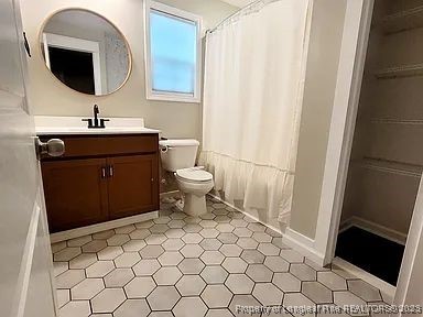 83 Kotata Avenue Bunnlevel, NC 28323 - Photo 13 of 17 a bathroom with a sink and a mirror
