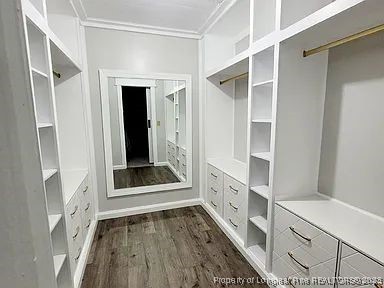 83 Kotata Avenue Bunnlevel, NC 28323 - Photo 15 of 17 a view of an entryway with wooden floor and cabinet