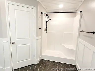 83 Kotata Avenue Bunnlevel, NC 28323 - Photo 17 of 17 a bathroom with a glass shower door