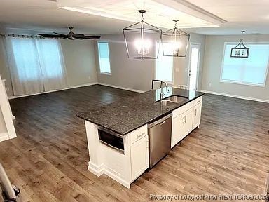 83 Kotata Avenue Bunnlevel, NC 28323 - Photo 5 of 17 an empty room with wooden floor and wooden floor