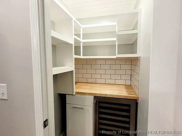 a bathroom with a sink and a window
