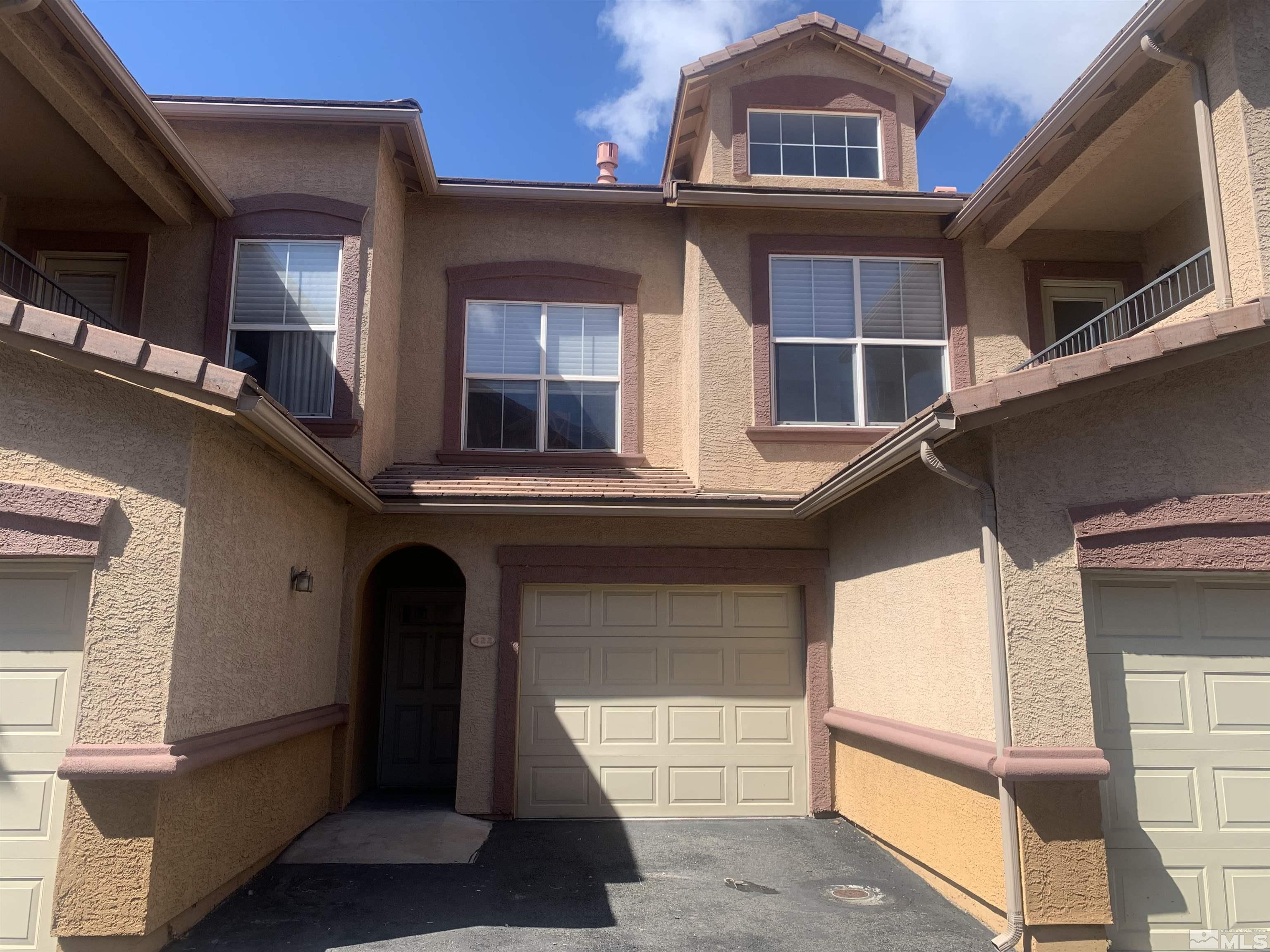 1325 South Meadows Parkway, Unit 422 Reno, NV 89521 - Photo 1 of 10 a view of a building with a large window
