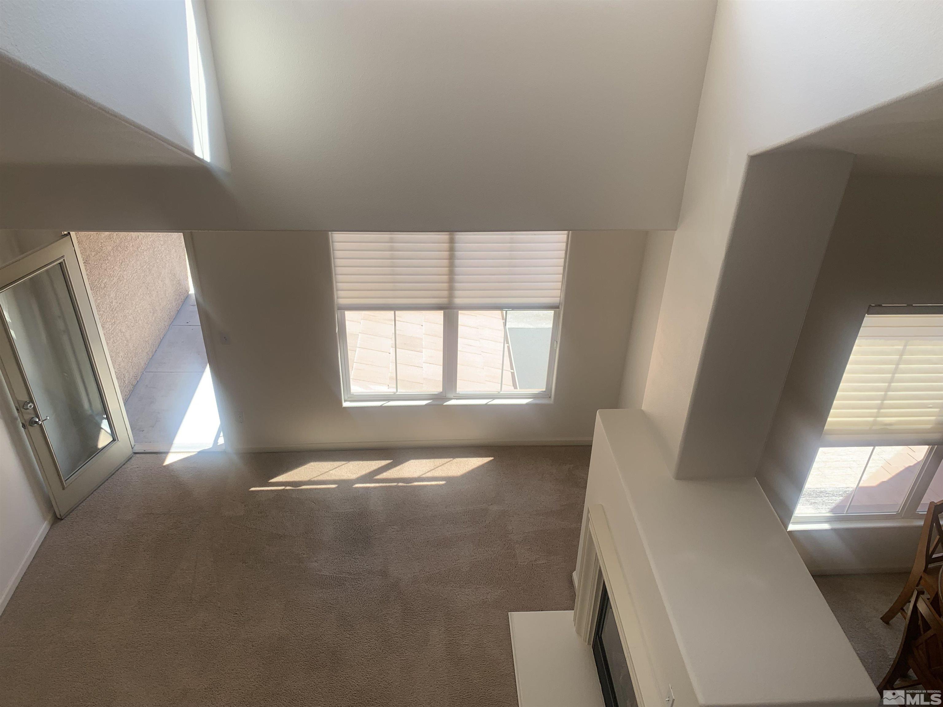1325 South Meadows Parkway, Unit 422 Reno, NV 89521 - Photo 2 of 10 a view of an empty room with a window