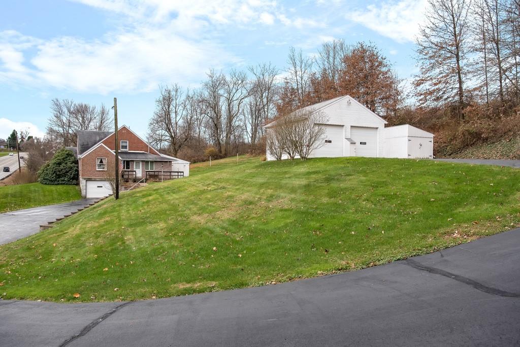 1038 Pittsburgh Road Valencia, PA 16059 - Photo 1 of 25 a aerial view of a house next to a big yard and large trees