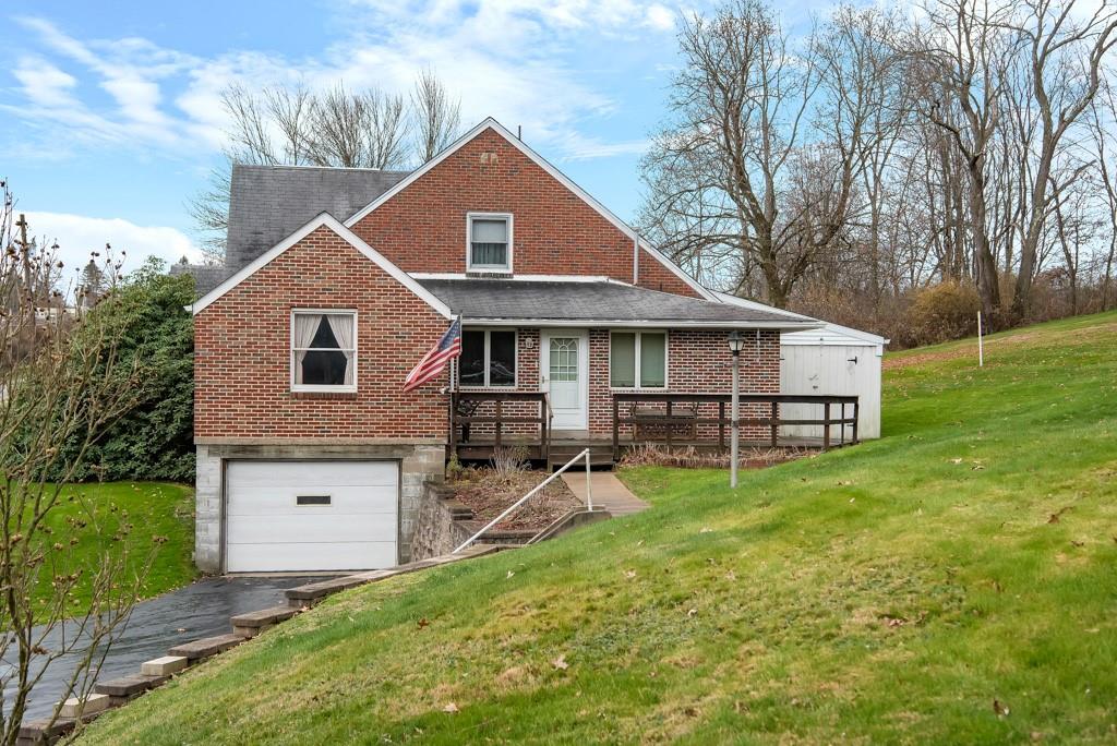 1038 Pittsburgh Road Valencia, PA 16059 - Photo 2 of 25 a front view of a house with garden
