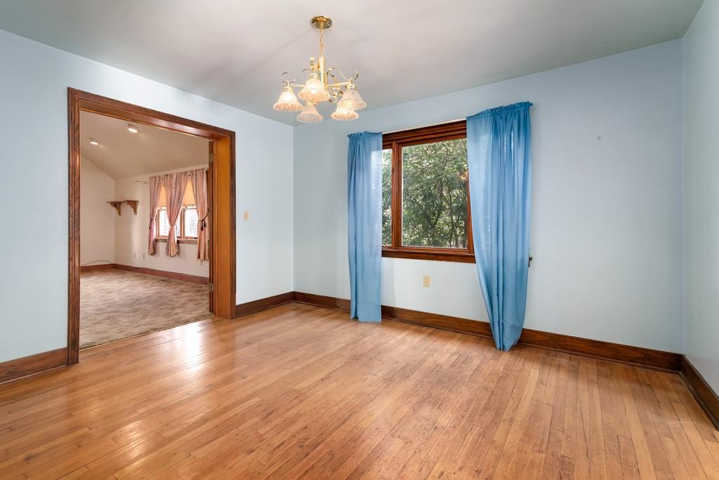 1038 Pittsburgh Road Valencia, PA 16059 - Photo 12 of 25 a view of an empty room with wooden floor and a window