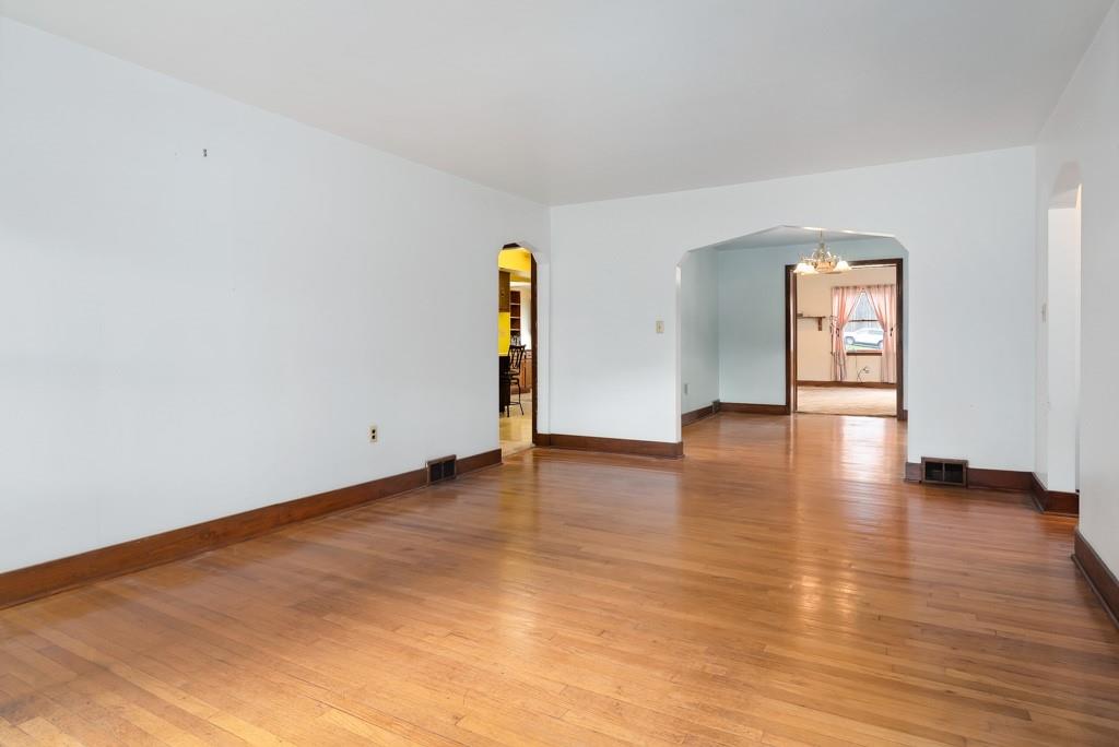 1038 Pittsburgh Road Valencia, PA 16059 - Photo 17 of 25 a view of an empty room with window and wooden floor