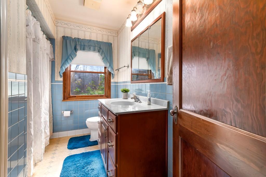 1038 Pittsburgh Road Valencia, PA 16059 - Photo 19 of 25 a view of bathroom with a sink and mirror with bathtub