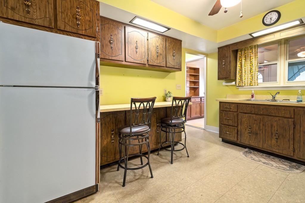 1038 Pittsburgh Road Valencia, PA 16059 - Photo 8 of 25 a kitchen with a refrigerator and table chair