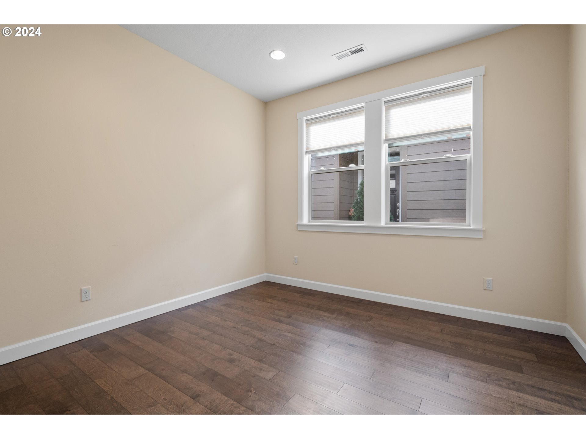 17632 Northeast 17th Avenue Ridgefield, WA 98642 - Photo 12 of 30 a view of an empty room with wooden floor and a window