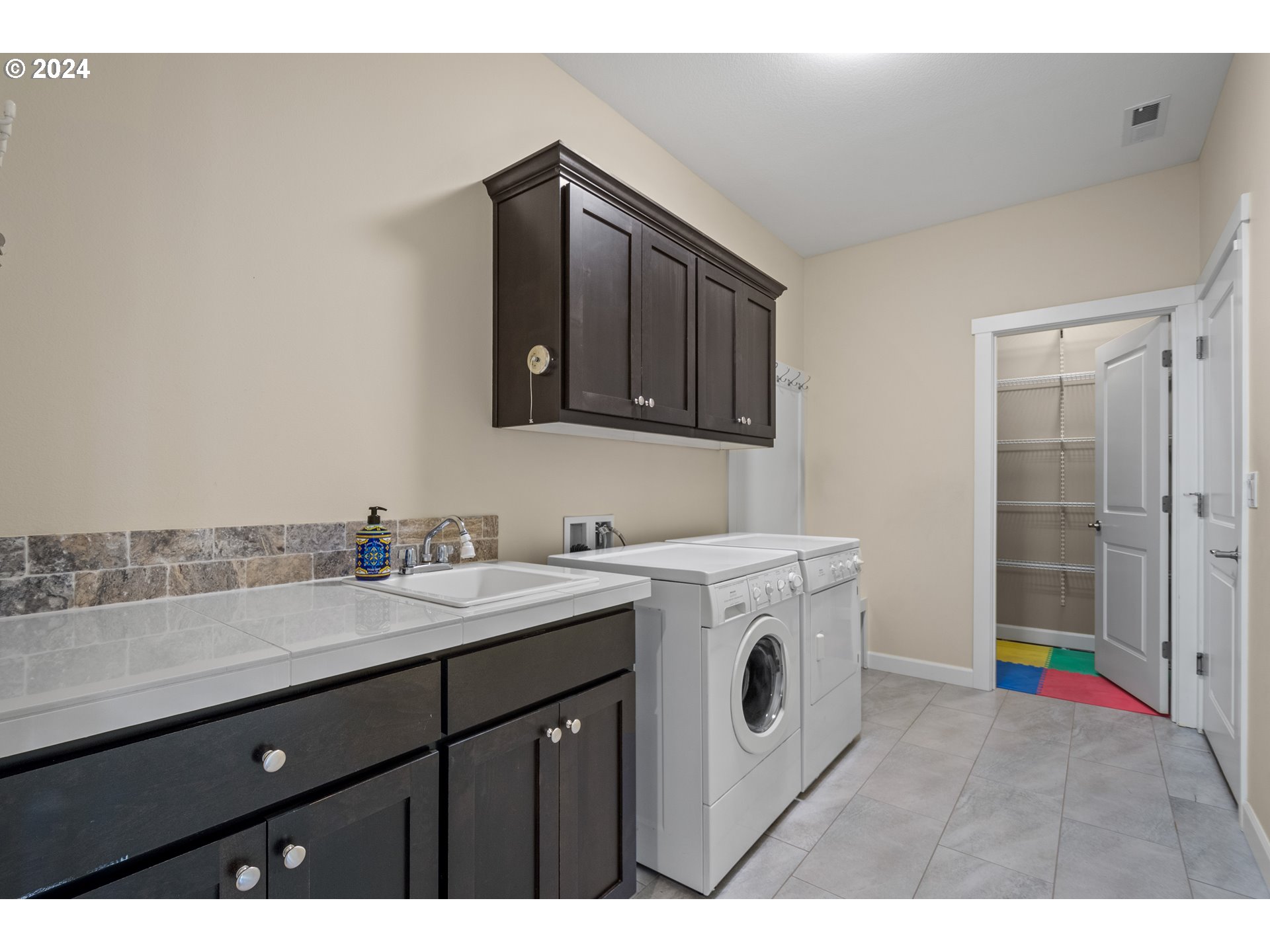 17632 Northeast 17th Avenue Ridgefield, WA 98642 - Photo 22 of 30 a utility room with sink dryer and washer