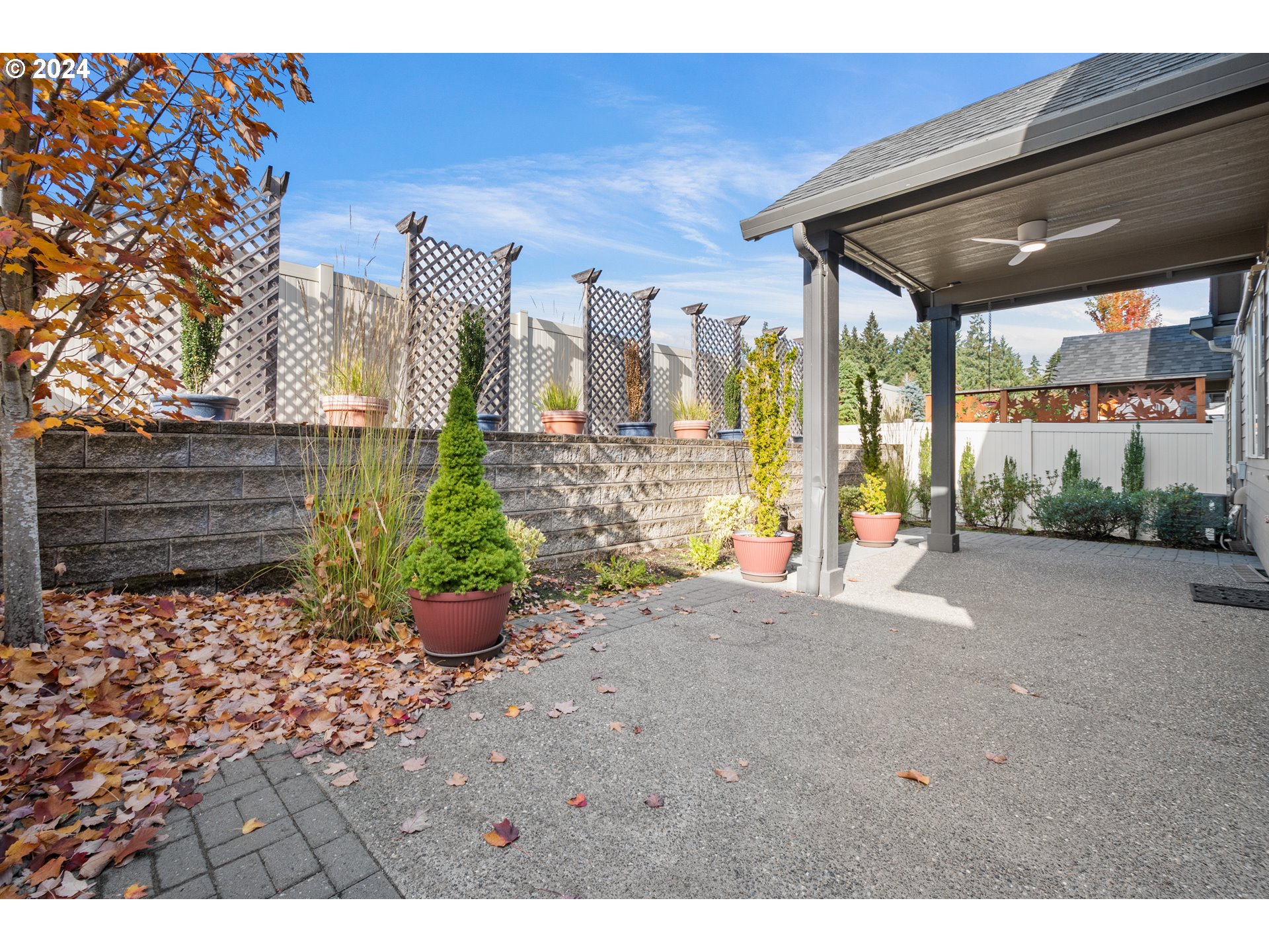 17632 Northeast 17th Avenue Ridgefield, WA 98642 - Photo 27 of 30 a view of a patio with table and chairs potted plants