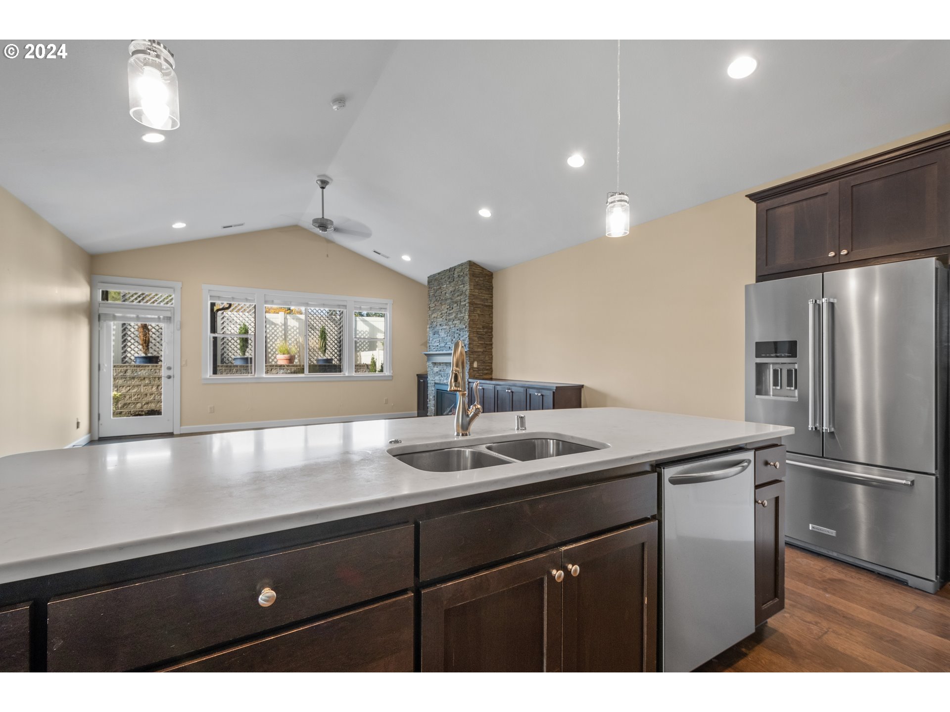 17632 Northeast 17th Avenue Ridgefield, WA 98642 - Photo 10 of 30 a kitchen with a sink and refrigerator