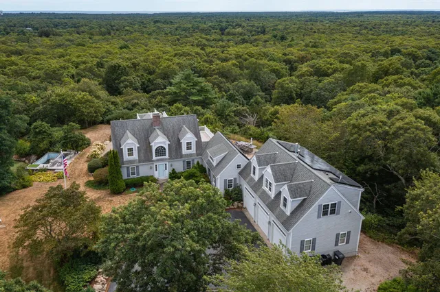 an aerial view of a house with a garden