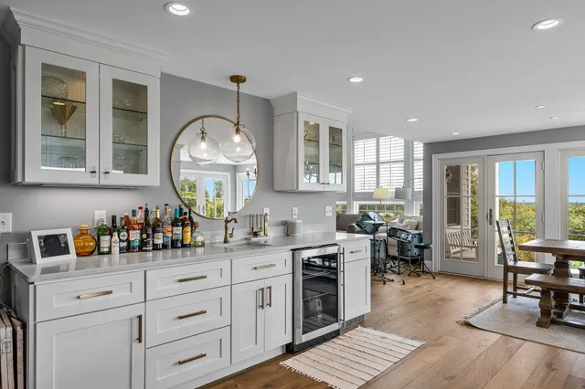 a kitchen with sink a stove and cabinets