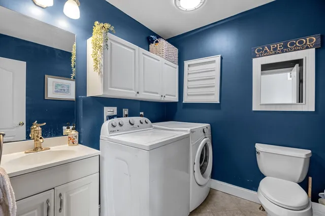 a view of bathroom with a washer and dryer