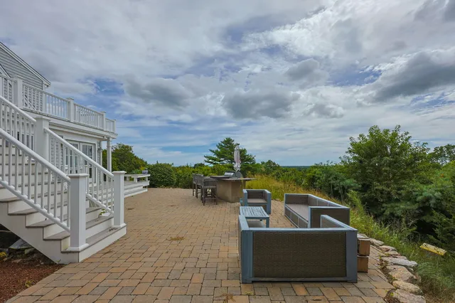 a view of an outdoor sitting area with furniture