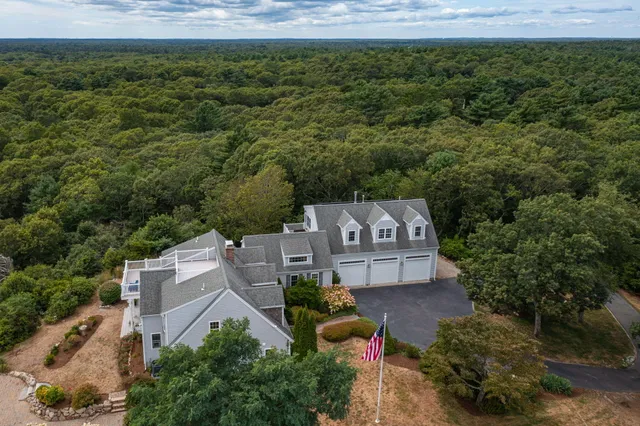 an aerial view of a house with a garden