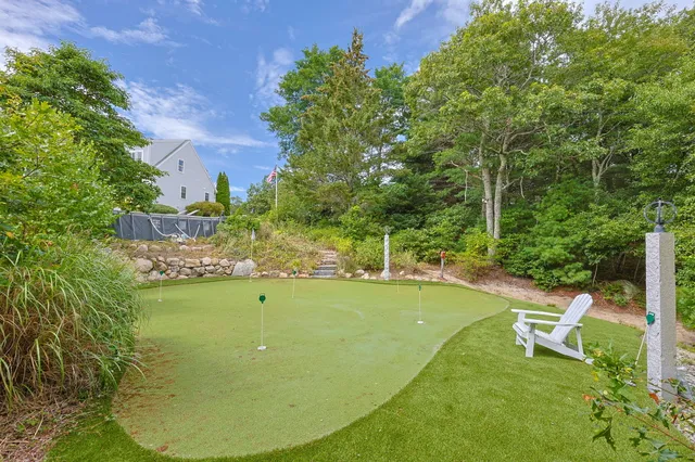 a view of a swimming pool with an outdoor seating area