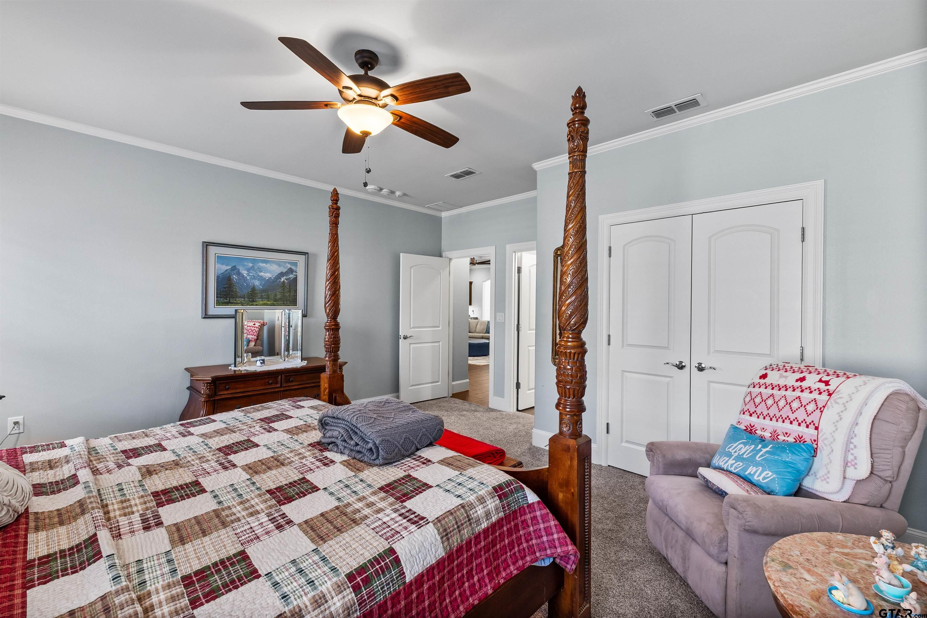 1111 Cambridge Bend Tyler, TX 75703 - Photo 25 of 42 a bedroom with a bed couch and window