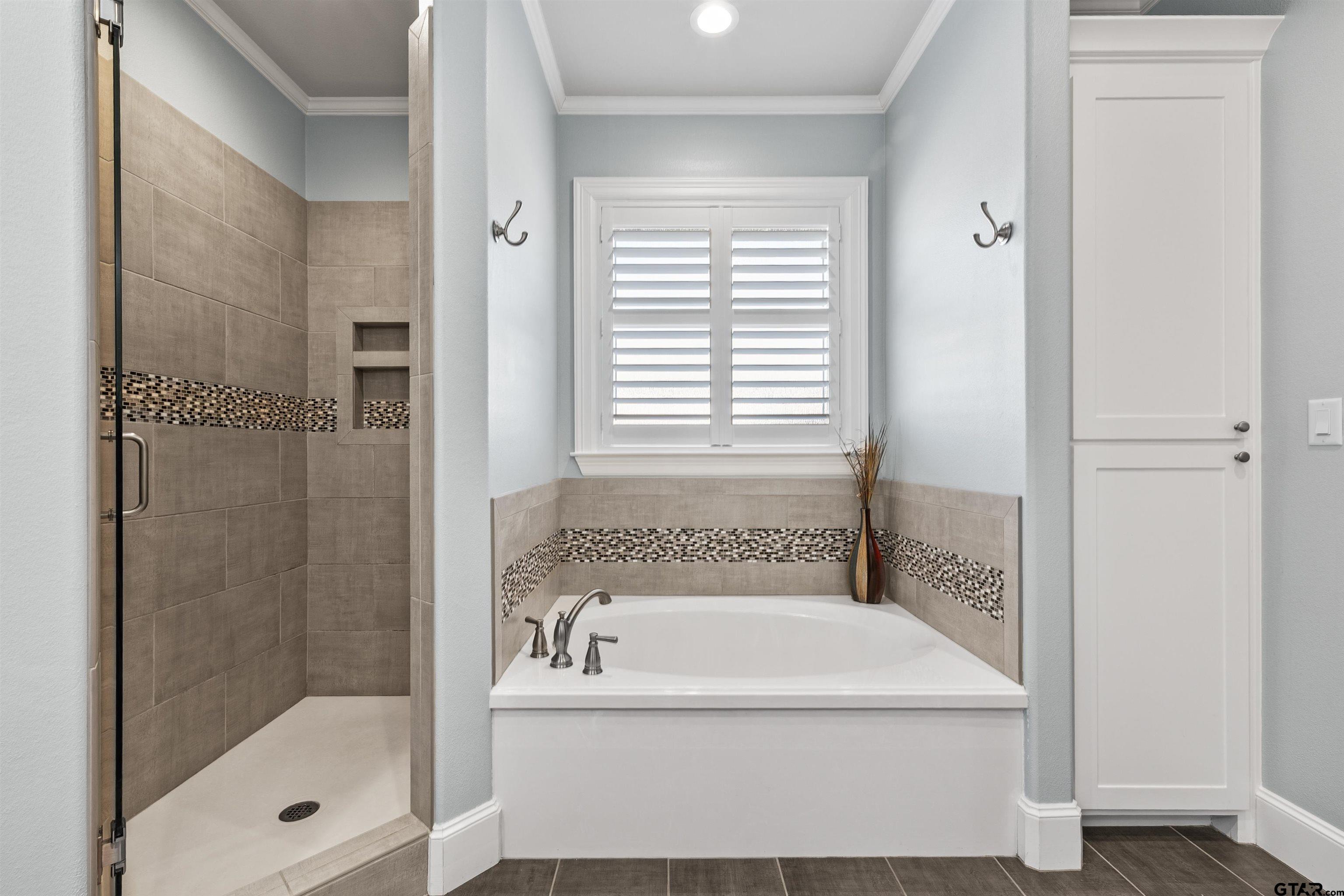 1111 Cambridge Bend Tyler, TX 75703 - Photo 32 of 42 a bathroom with a bathtub and shower