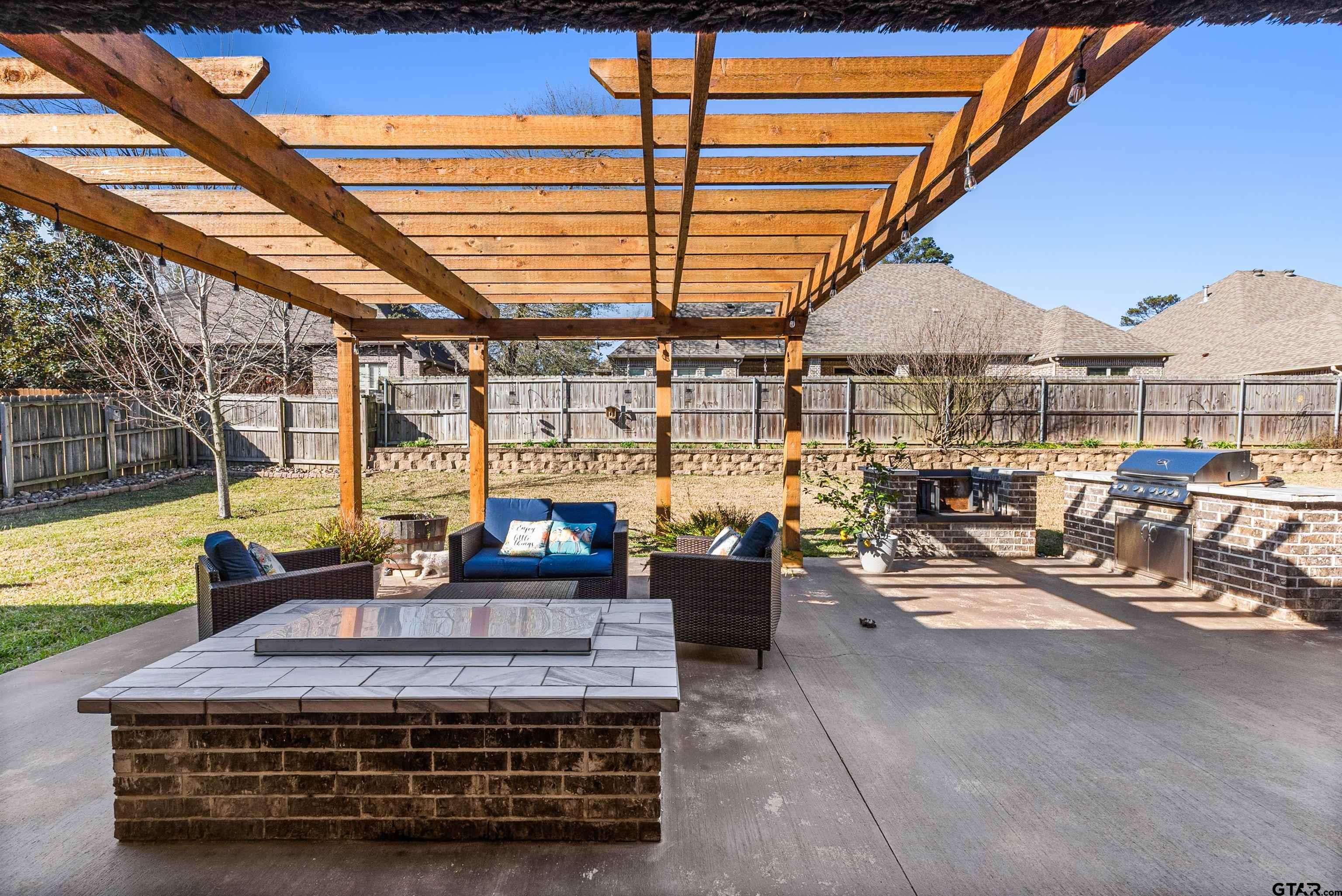 1111 Cambridge Bend Tyler, TX 75703 - Photo 36 of 42 a view of a patio with couches chairs and potted plants