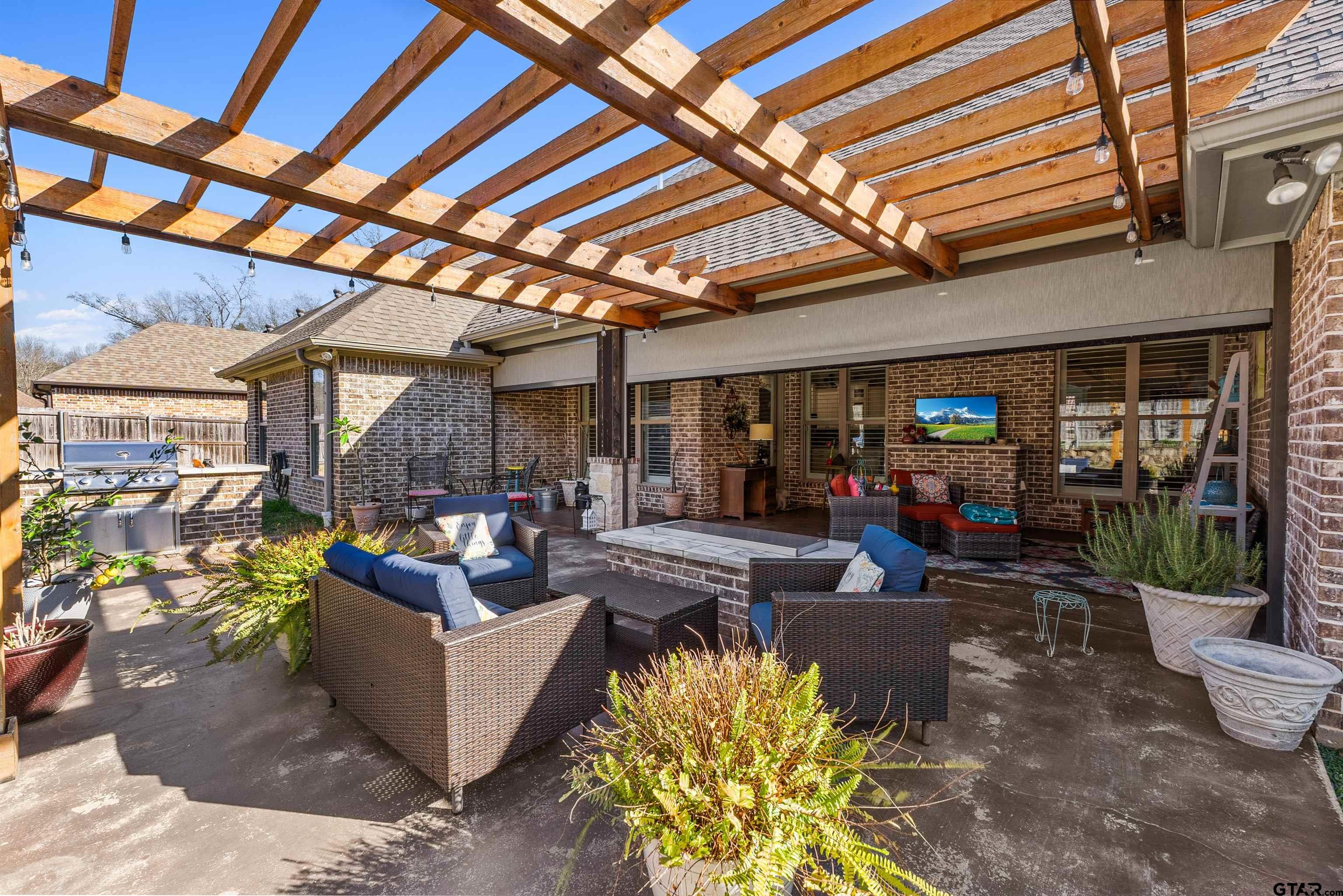 1111 Cambridge Bend Tyler, TX 75703 - Photo 37 of 42 a living room with furniture and a outdoor space
