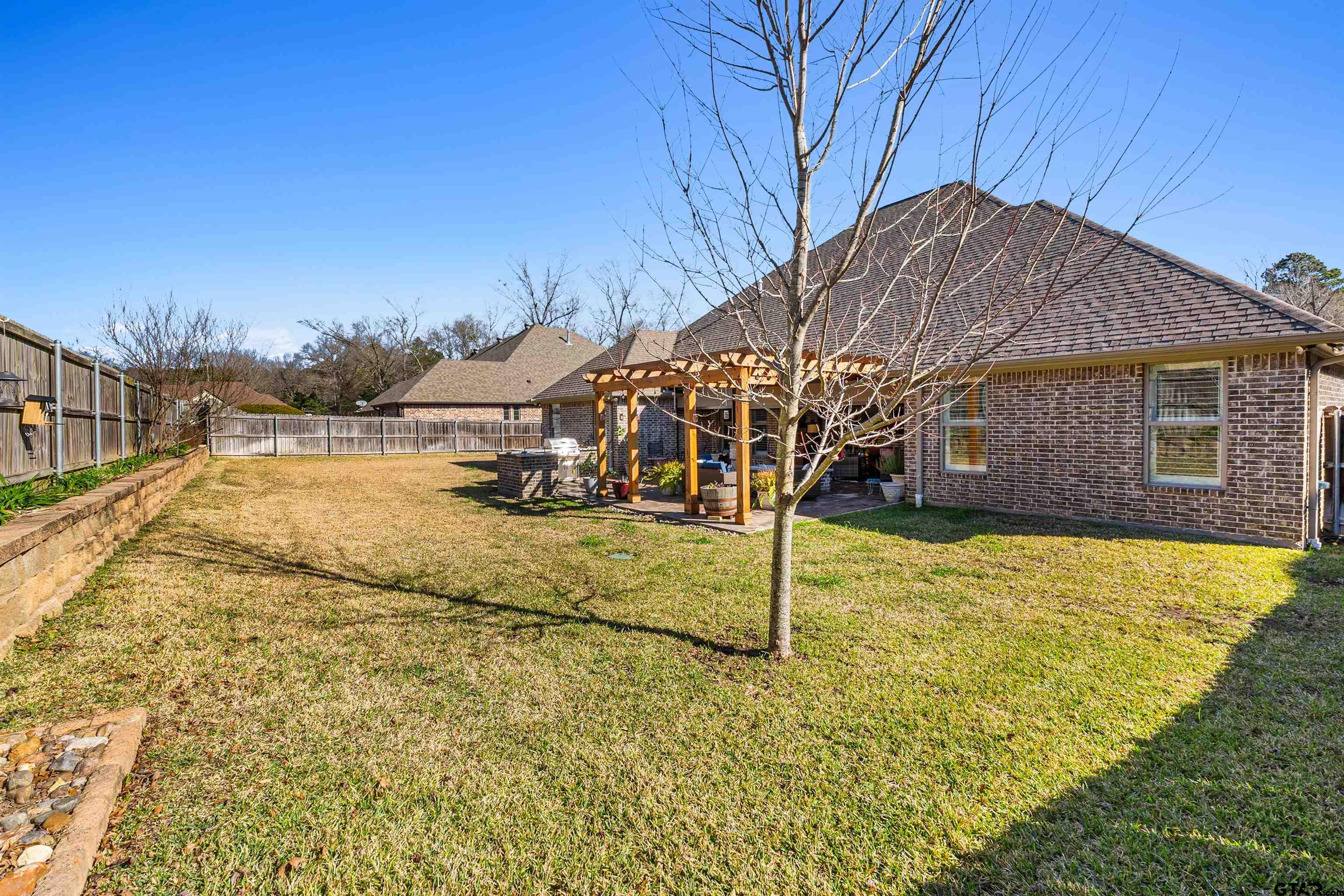 1111 Cambridge Bend Tyler, TX 75703 - Photo 41 of 42 a view of a house with a yard
