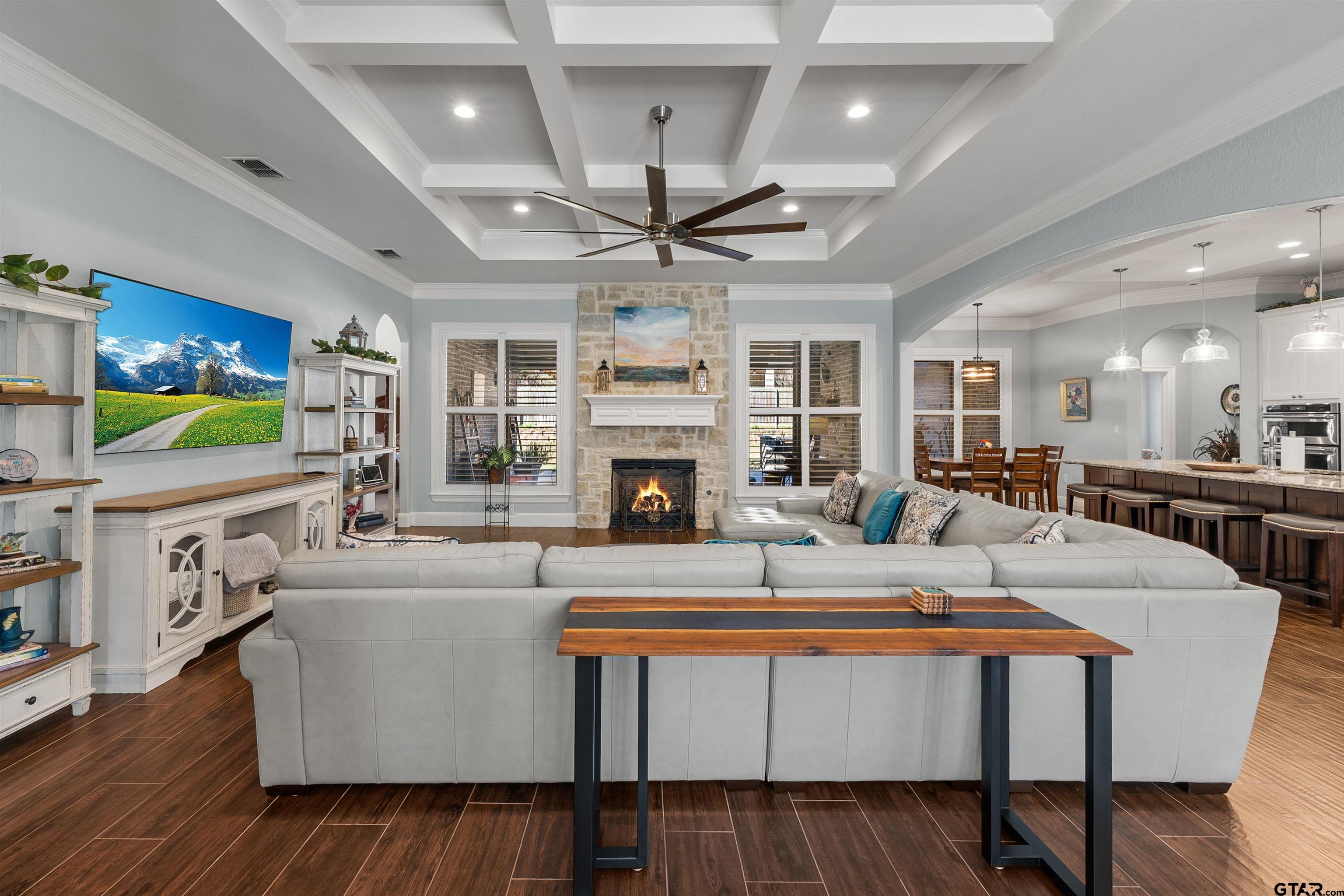 1111 Cambridge Bend Tyler, TX 75703 - Photo 6 of 42 a living room with furniture a fireplace and a flat screen tv